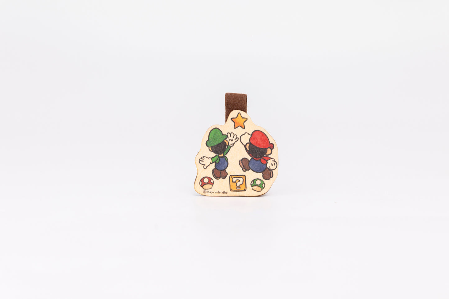 "Cute Mario wooden magnet bookmark"
"Handcrafted wooden Mario bookmark with magnet clasp"
"Eco-friendly wooden Mario bookmark for gamers"
"Wooden Mario magnetic bookmark on an open book"
"Handmade Mario bookmark with light magnet for secure fit"
"Mario magnetic bookmark for books, planners, and journals"
"Unique Mario gift for readers and classic video game fans"