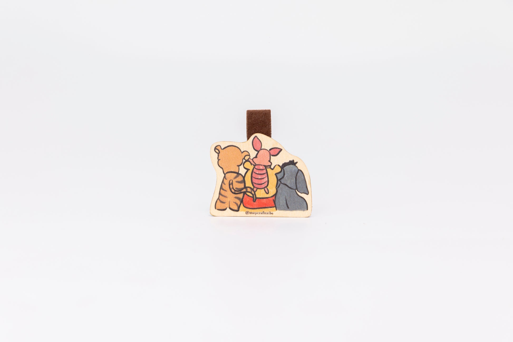 Cute Pooh Bear wooden magnet bookmark"
"Handcrafted wooden Pooh Bear bookmark with magnet clasp"
"Eco-friendly wooden Pooh Bear bookmark for classic story fans"
"Wooden Pooh Bear magnetic bookmark on an open book"
"Handmade Pooh Bear bookmark with light magnet for secure fit"
"Pooh Bear magnetic bookmark for books, planners, and journals"
"Unique Pooh Bear gift for readers and children’s book enthusiasts