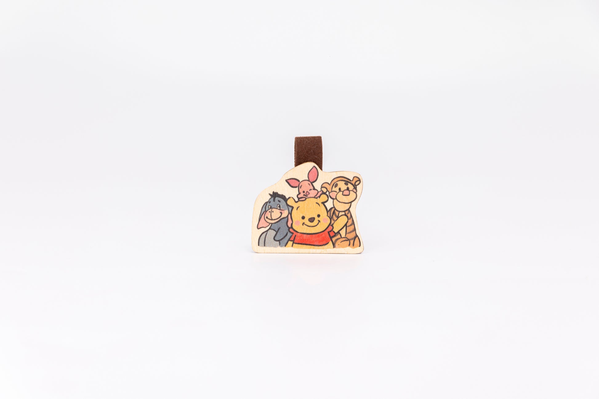 Cute Pooh Bear wooden magnet bookmark"
"Handcrafted wooden Pooh Bear bookmark with magnet clasp"
"Eco-friendly wooden Pooh Bear bookmark for classic story fans"
"Wooden Pooh Bear magnetic bookmark on an open book"
"Handmade Pooh Bear bookmark with light magnet for secure fit"
"Pooh Bear magnetic bookmark for books, planners, and journals"
"Unique Pooh Bear gift for readers and children’s book enthusiasts